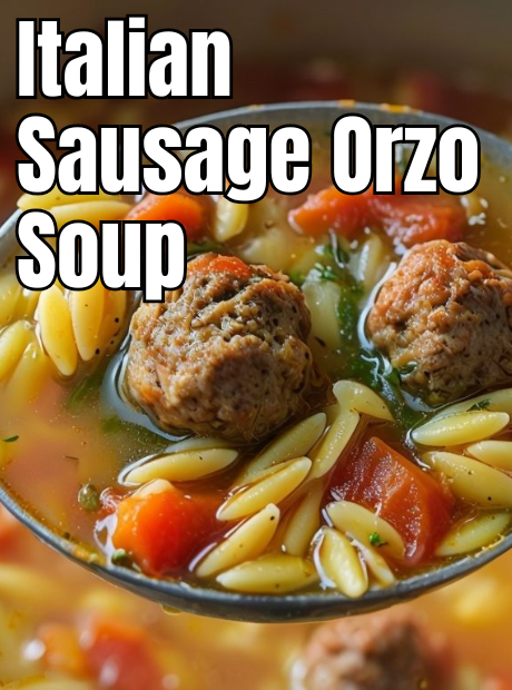 A close-up of a steaming bowl of Italian Sausage Soup, garnished with fresh basil and parmesan cheese."

