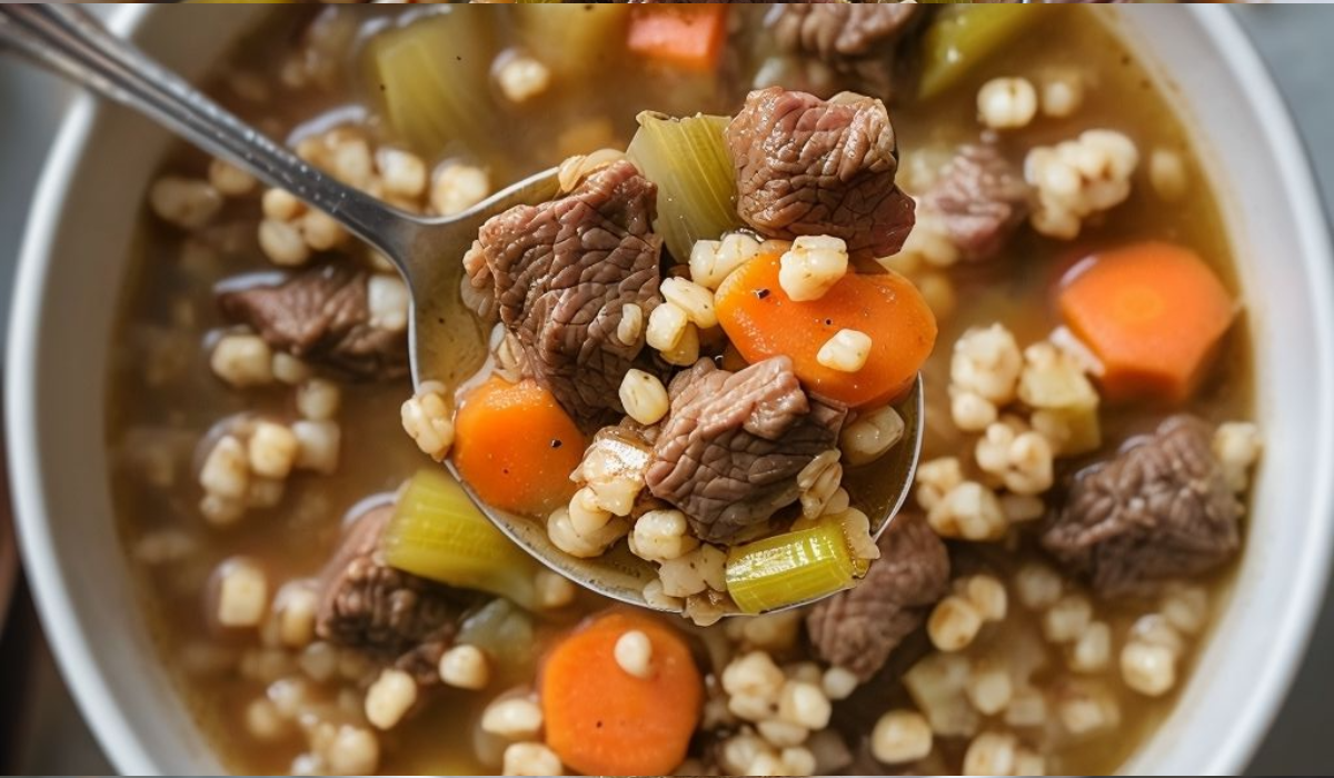A bowl of hearty beef barley soup, filled with tender beef, rich broth, and perfectly cooked barley