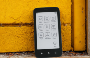 Mudita Kompakt Front View: "Mudita Kompakt minimalist phone featuring a crisp E Ink display and soft-touch body.